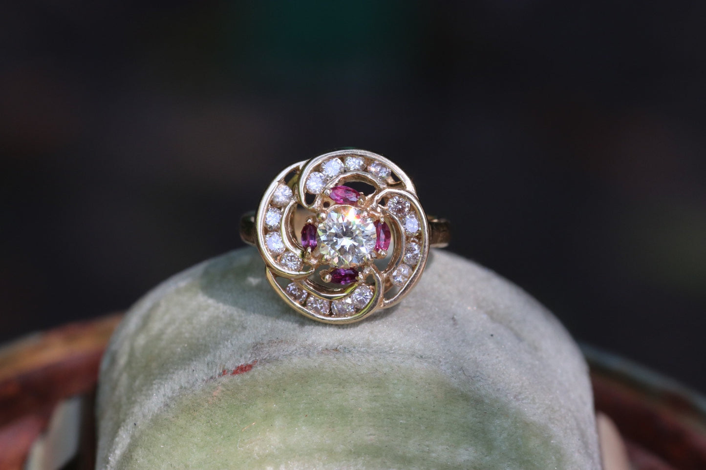 Transitional cut diamond set in 14k yellow gold surrounded by rubies and modern round diamonds size 5.75 (sizable)
