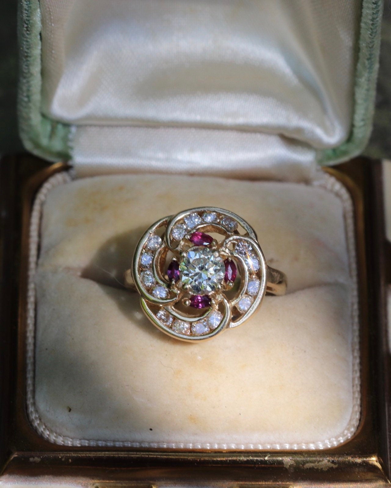Transitional cut diamond set in 14k yellow gold surrounded by rubies and modern round diamonds size 5.75 (sizable)
