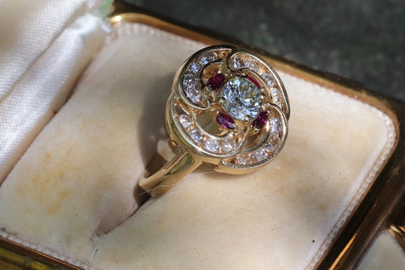 Transitional cut diamond set in 14k yellow gold surrounded by rubies and modern round diamonds size 5.75 (sizable)