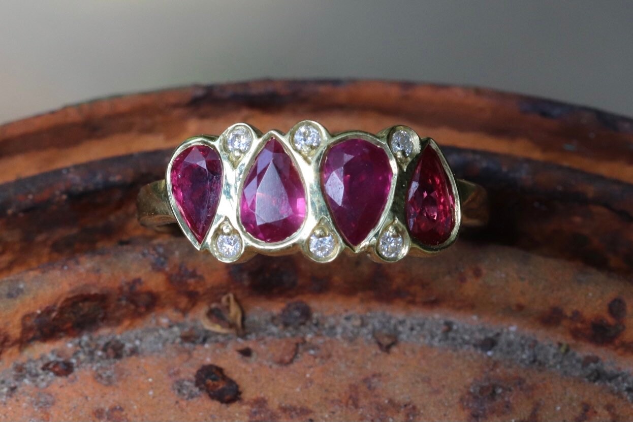 2.11 carat unheated rubies and .08 GVS diamond set an 18 K size 6.5 (sizable)