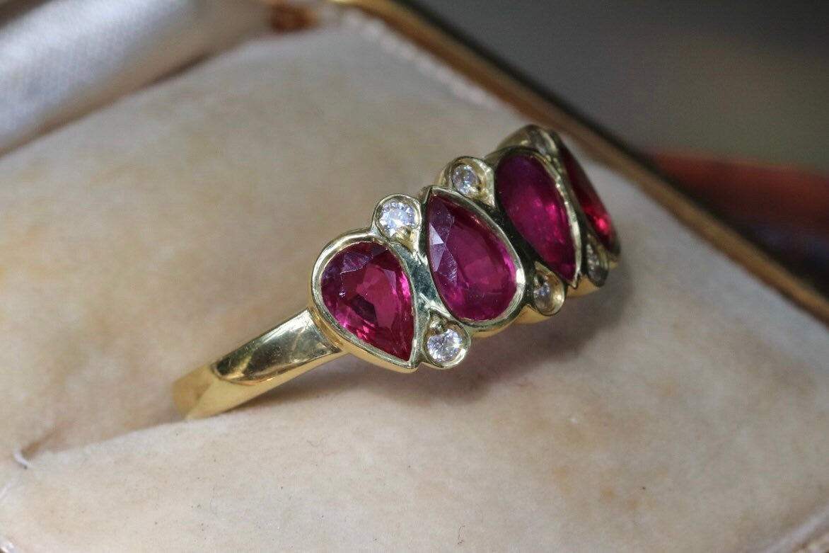 2.11 carat unheated rubies and .08 GVS diamond set an 18 K size 6.5 (sizable)