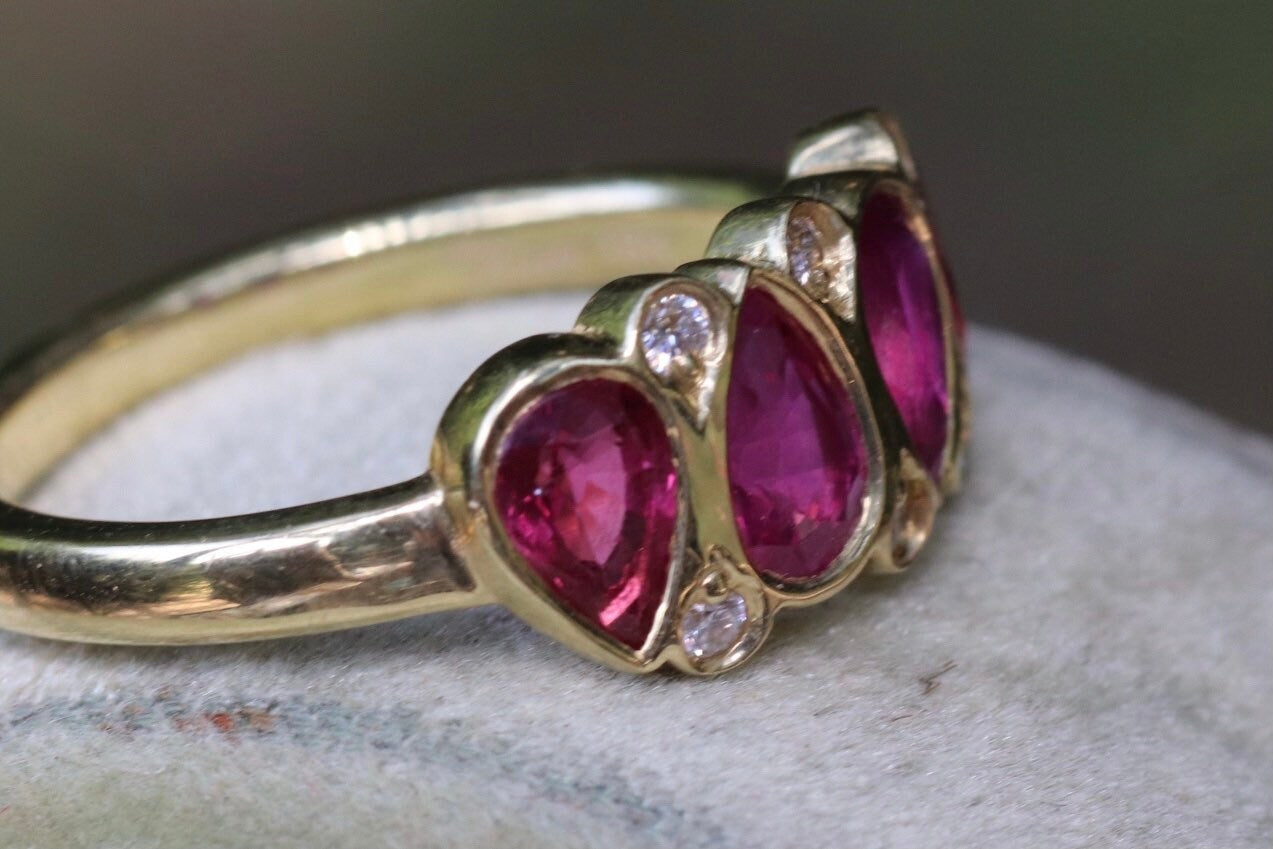 2.11 carat unheated rubies and .08 GVS diamond set an 18 K size 6.5 (sizable)