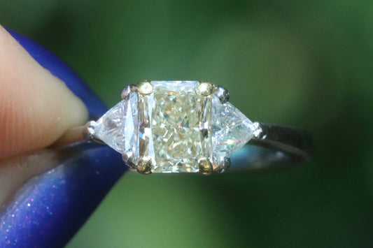 Yellow diamond radiant and diamond trapezoid three stone engagement ring set in platinum size 6 (sizable)