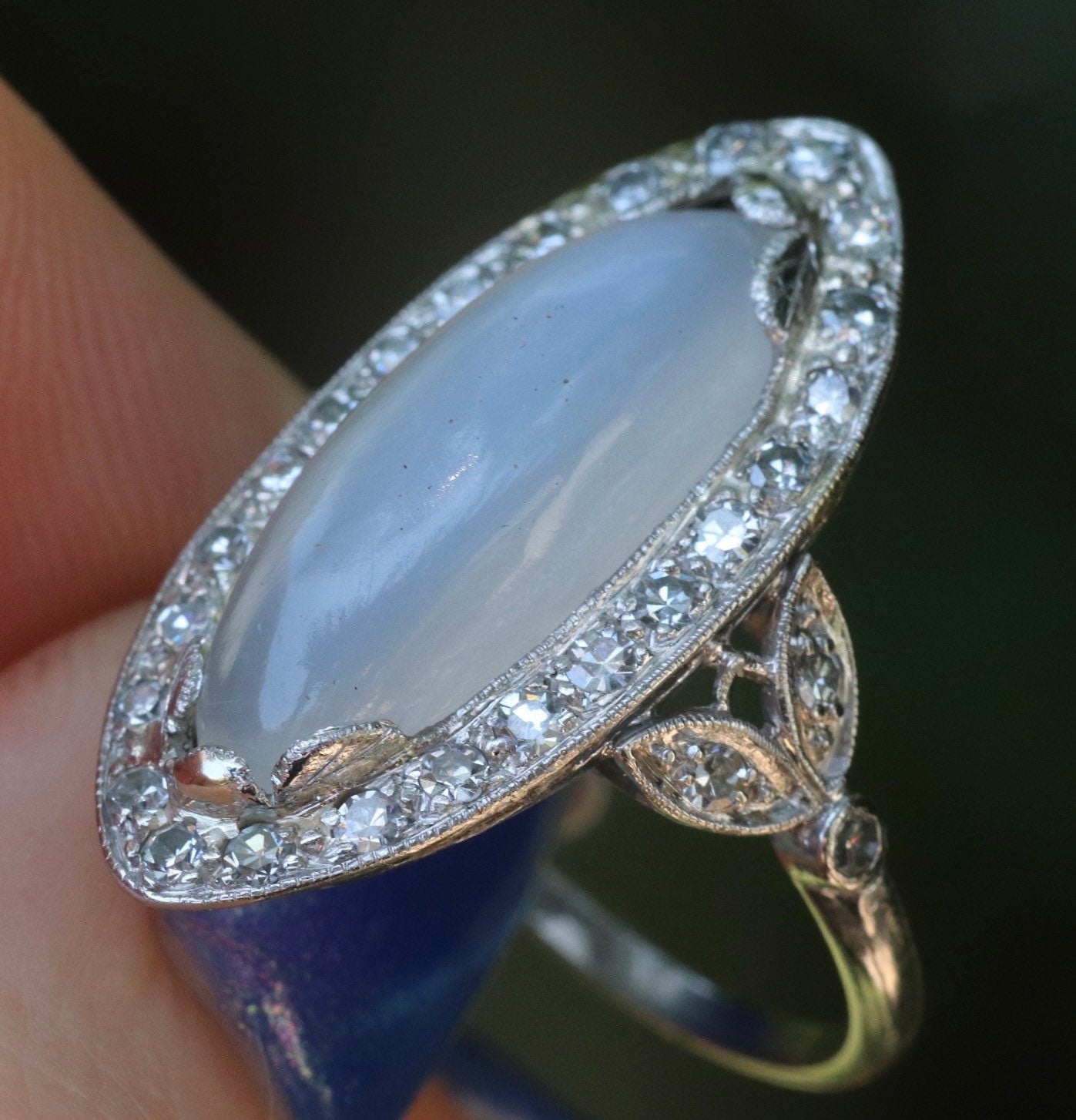 Genuine Art Deco moonstone ring with natural diamond halo set in platinum