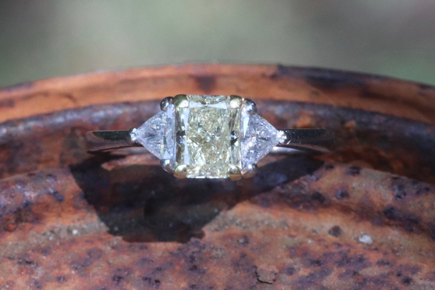 Yellow diamond radiant and diamond trapezoid three stone engagement ring set in platinum size 6 (sizable)