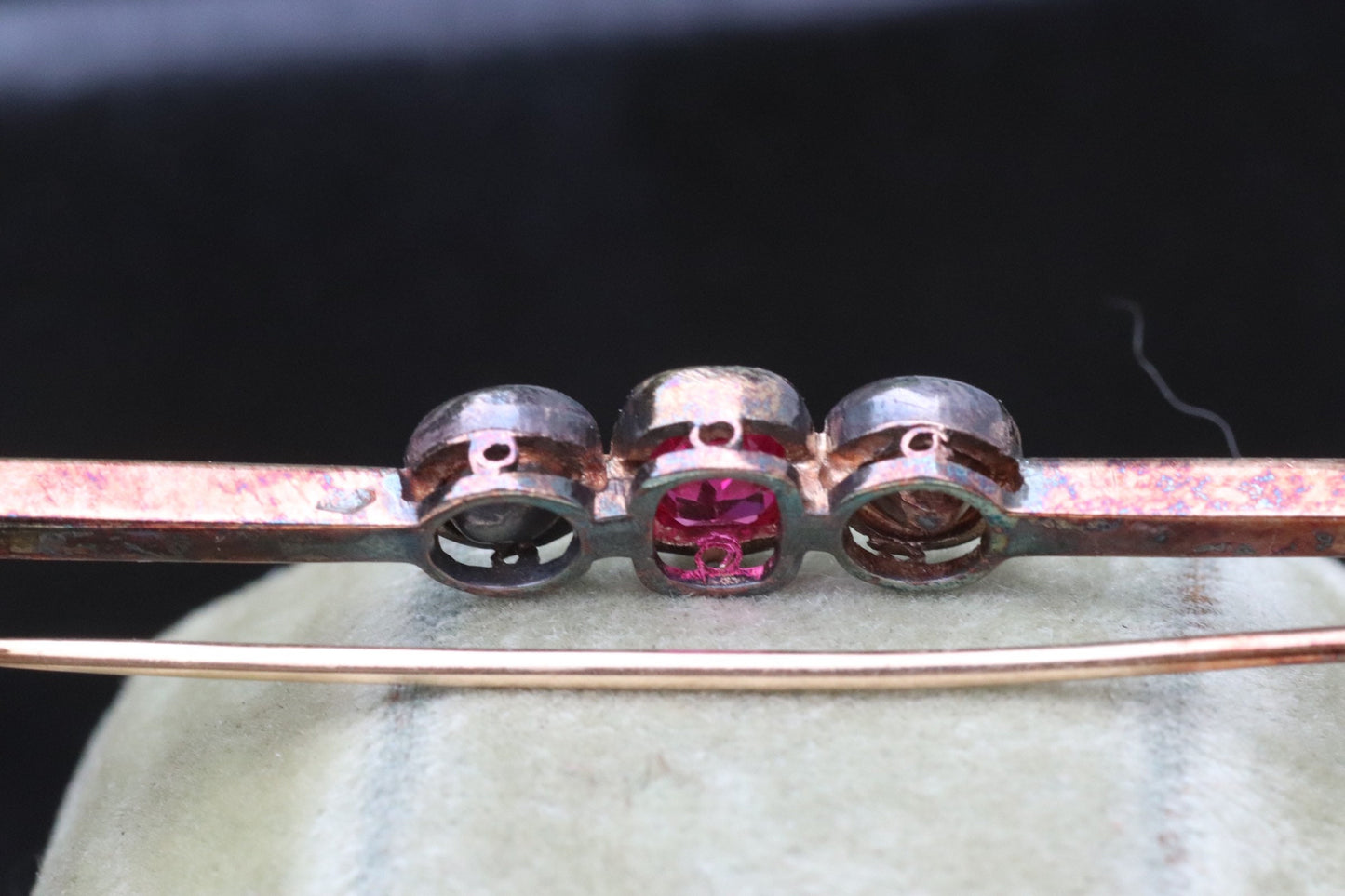 Synthetic ruby and rose cut diamond three stone pin set in 14 karat rose gold