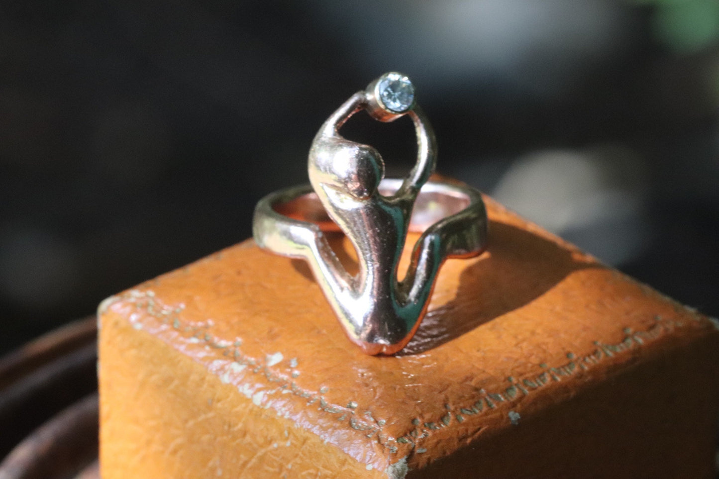 9ct rose gold naked woman holding a diamond ring size 7.25 (sizable)