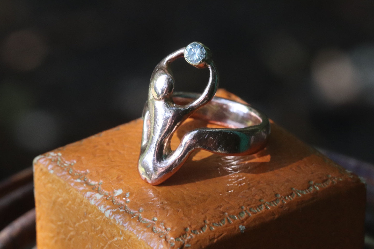 9ct rose gold naked woman holding a diamond ring size 7.25 (sizable)