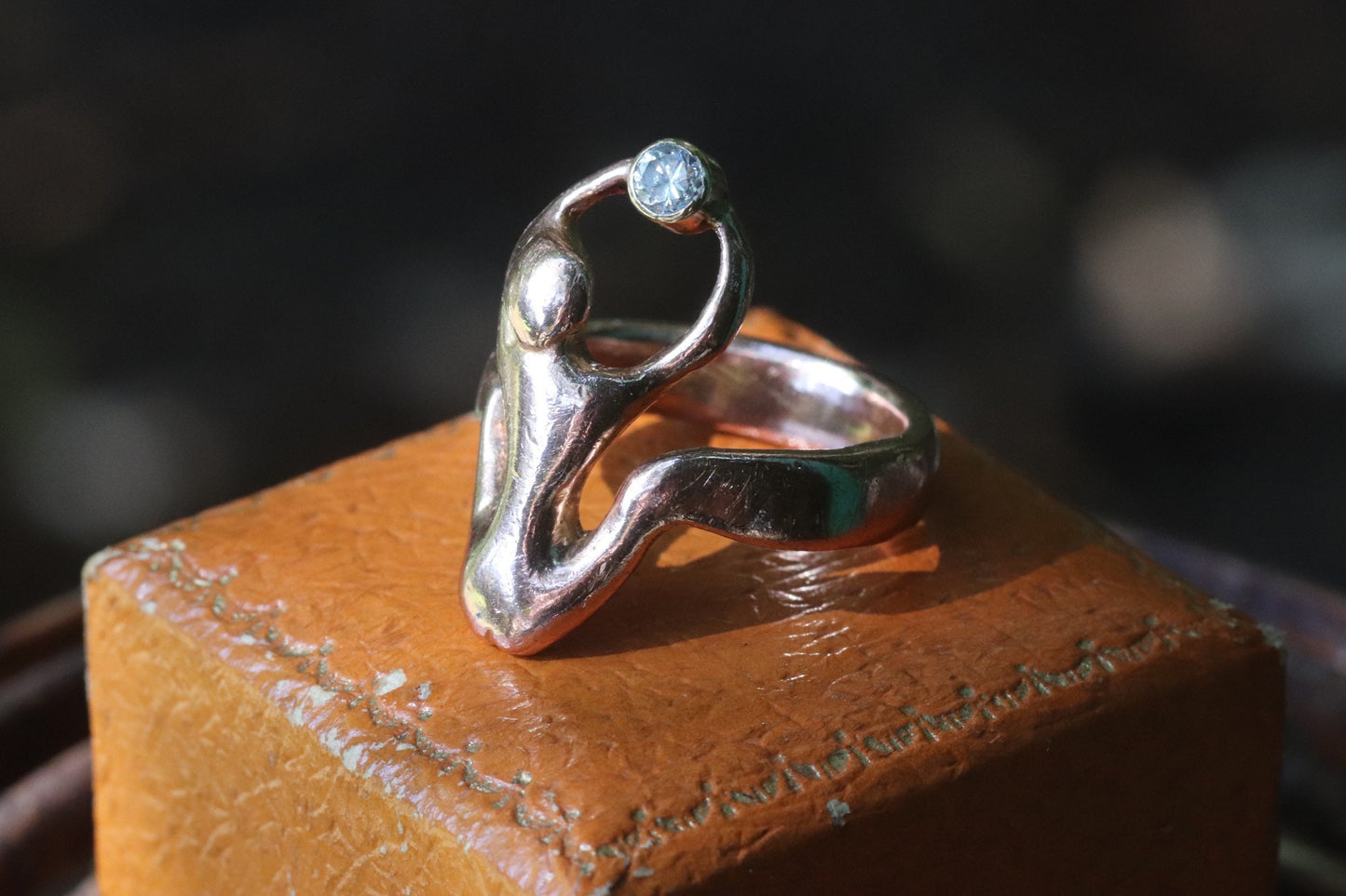 9ct rose gold naked woman holding a diamond ring size 7.25 (sizable)