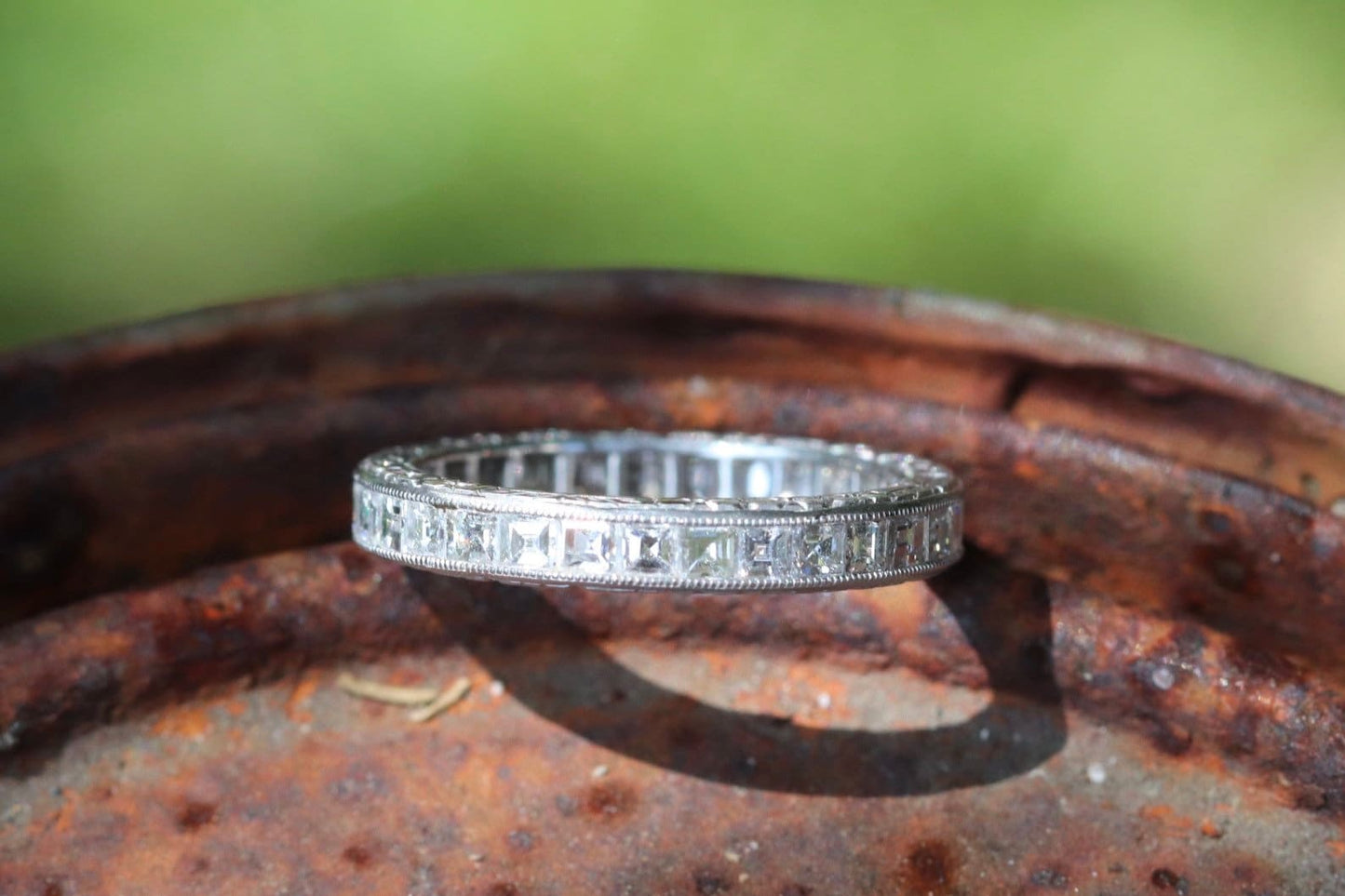 Engraved carre cut diamond eternity band set in platinum size 5