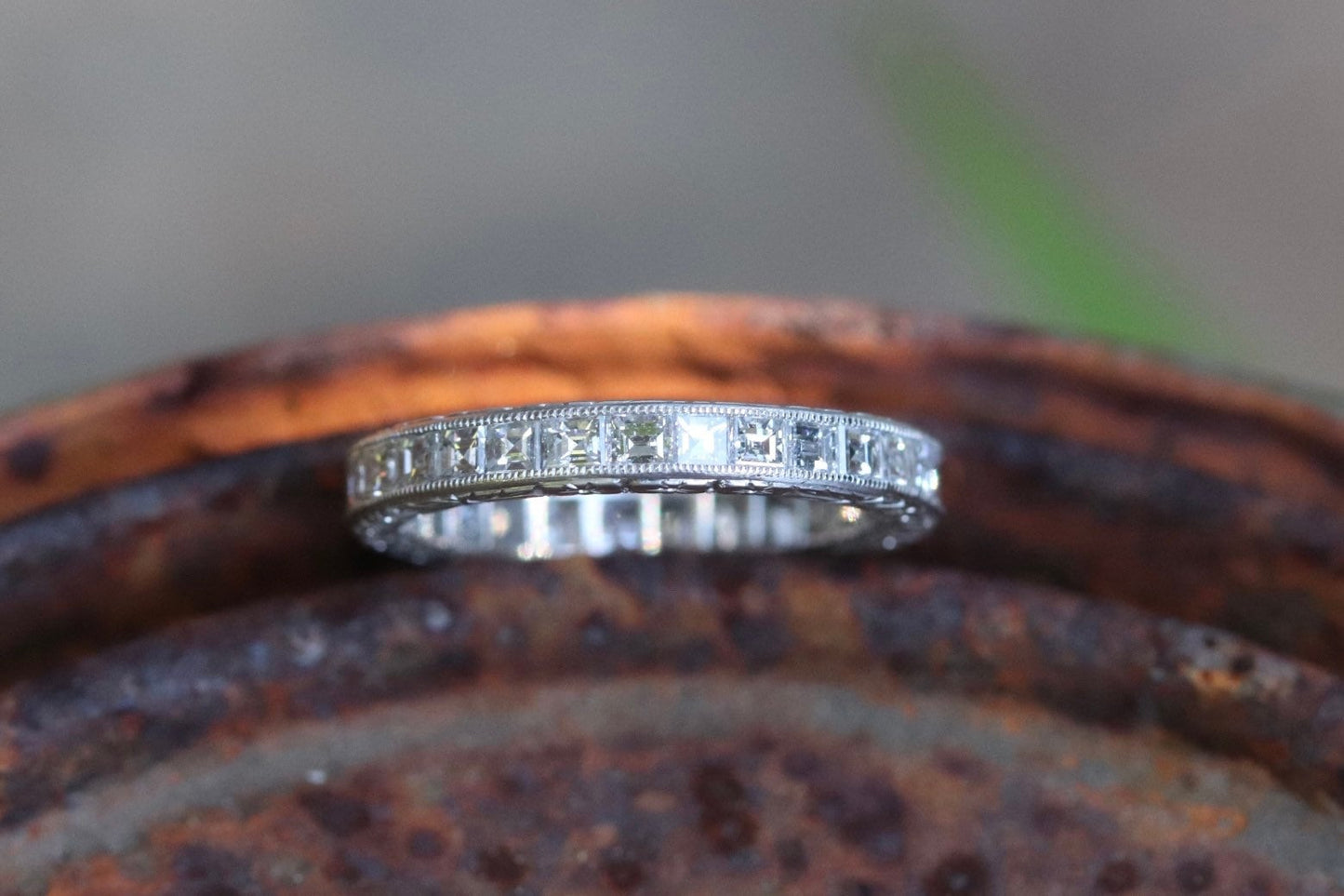 Engraved carre cut diamond eternity band set in platinum size 5
