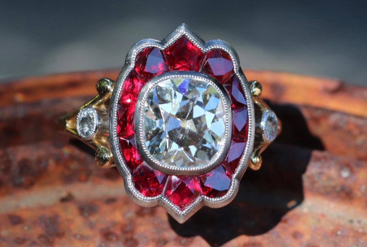 GIA certified old mine cut diamond with natural ruby halo in hand forged customs ring