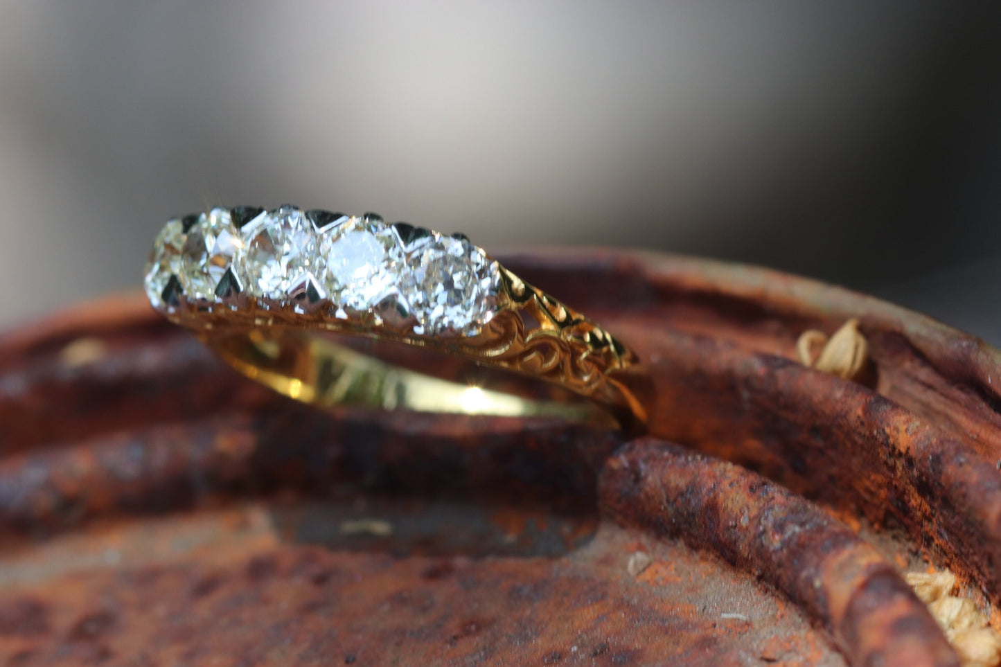 5-stone old mine cut diamond ring set in 18k yellow gold