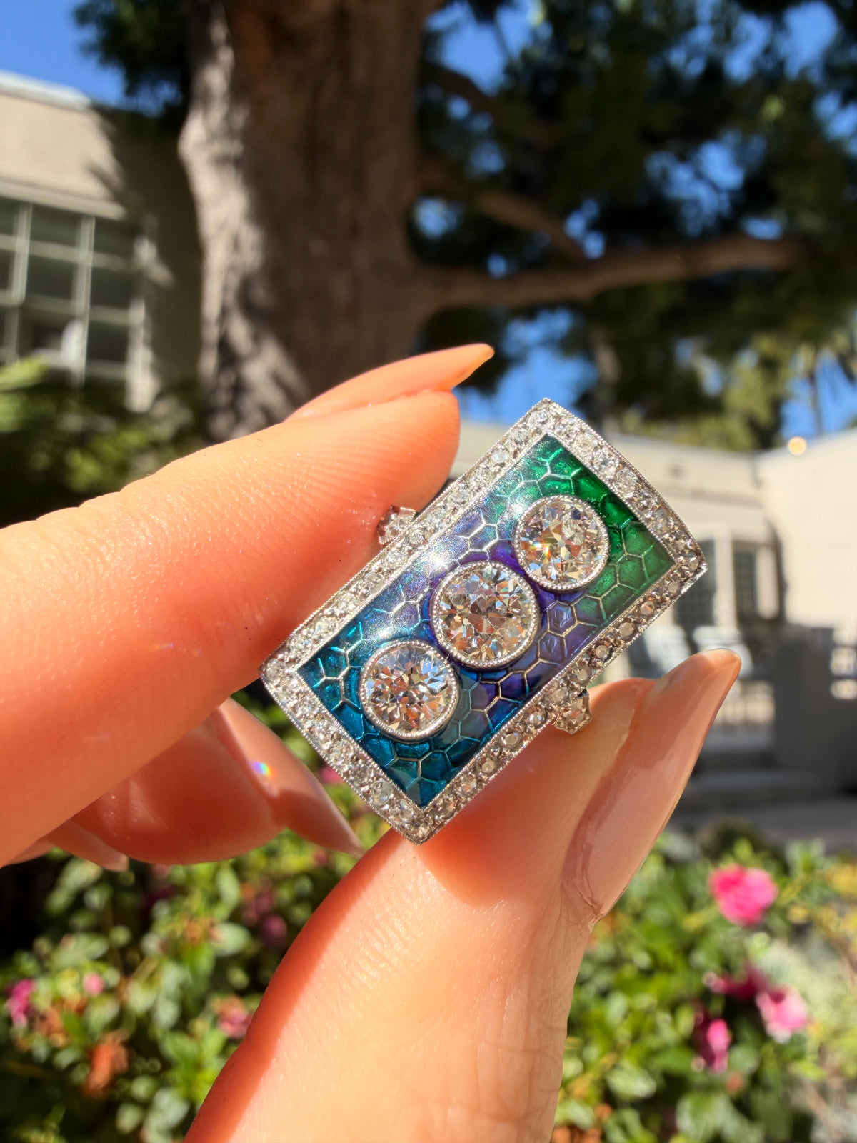 Pique-a-jour enamel ring in platinum with old European cut and mine cut diamonds