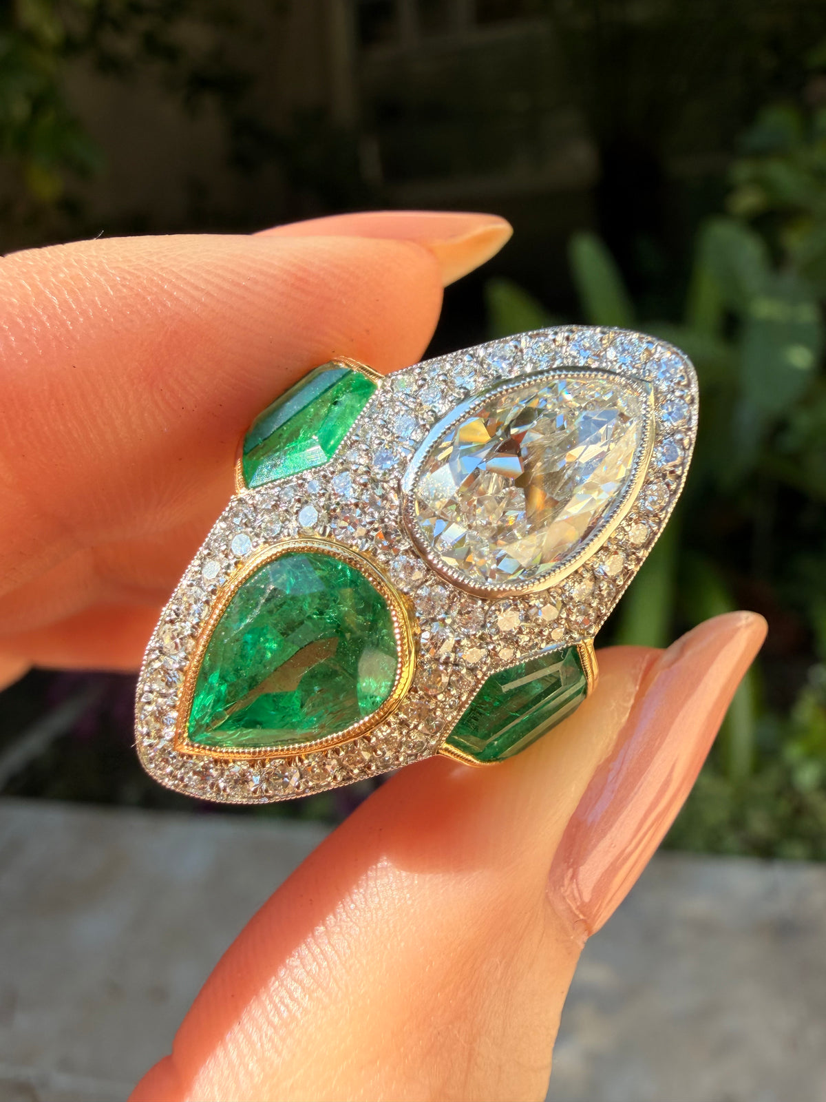 Antique pear shaped diamond and Russian emerald ring set in Gilded Lane original design