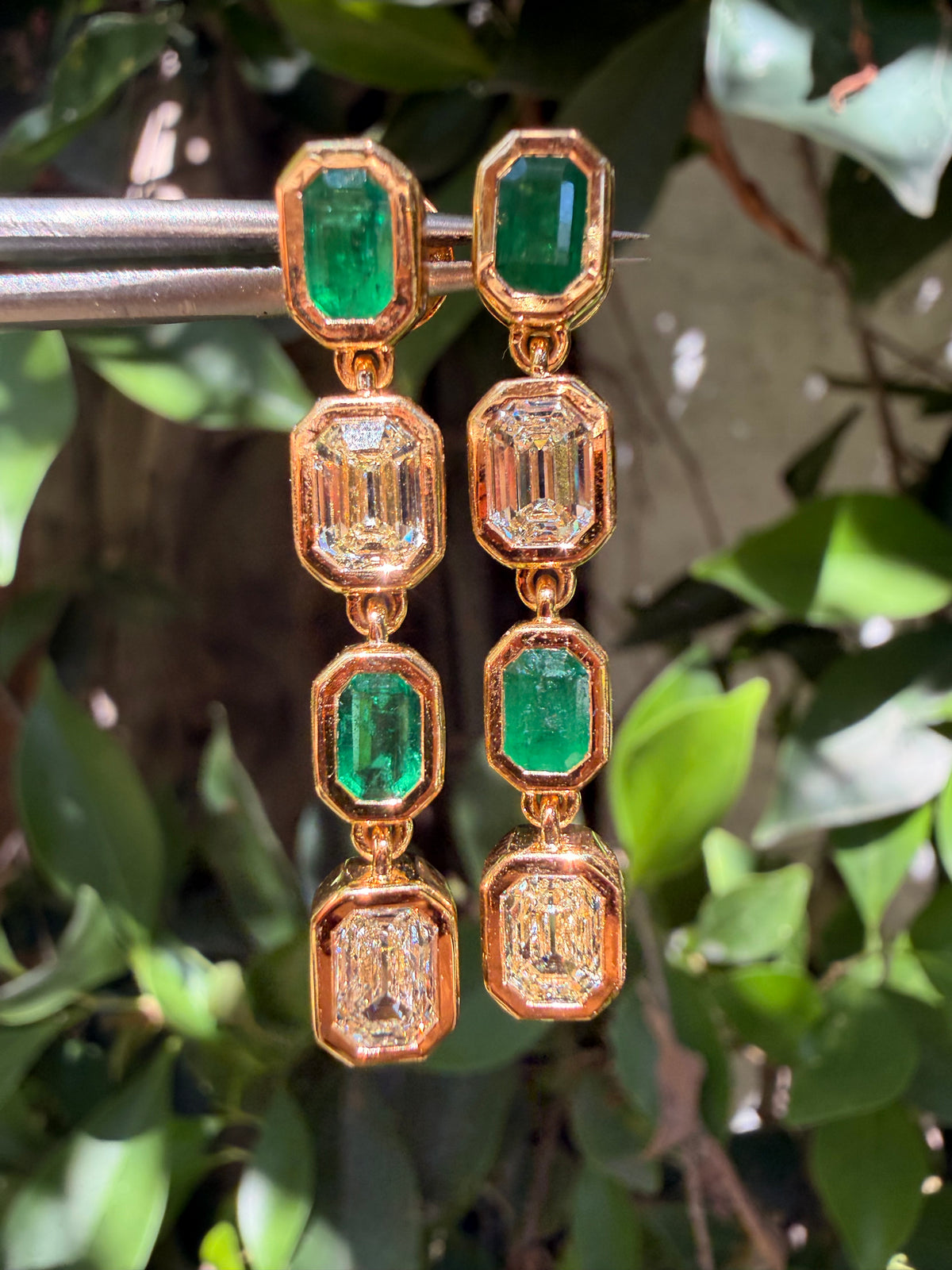 Natural emerald and antique emerald cut diamond earrings in 18 karat yellow gold