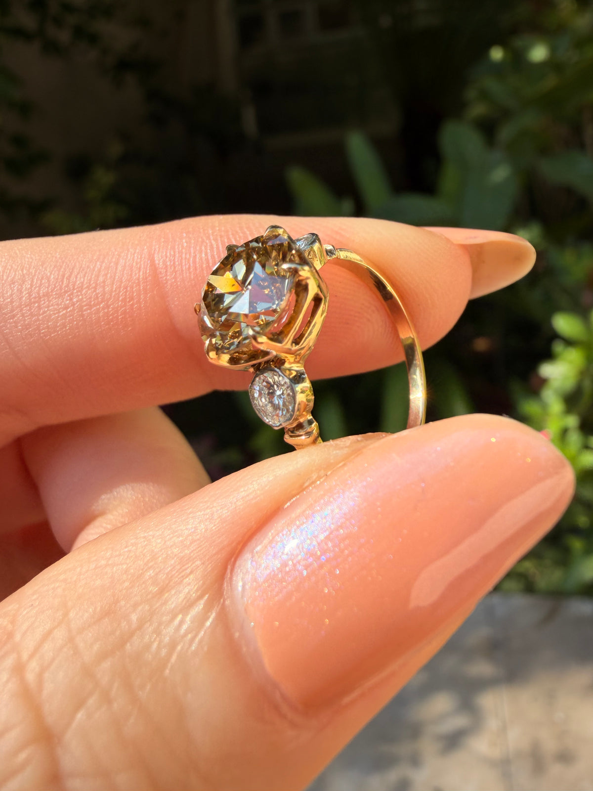 Natural golden yellow true antique old European cut diamond three stone ring in 14 K/platinum