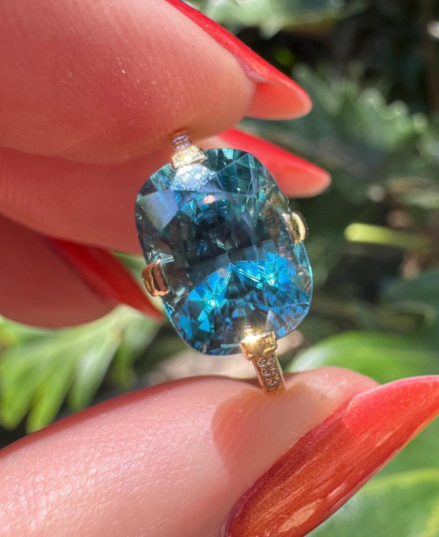 Custom-made blue zircon ring in 18 karat yellow gold