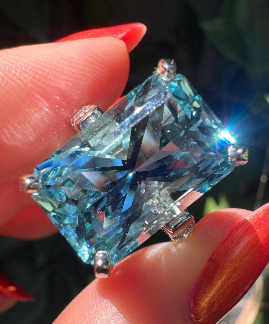 Giant precision cut aquamarine and diamond ring