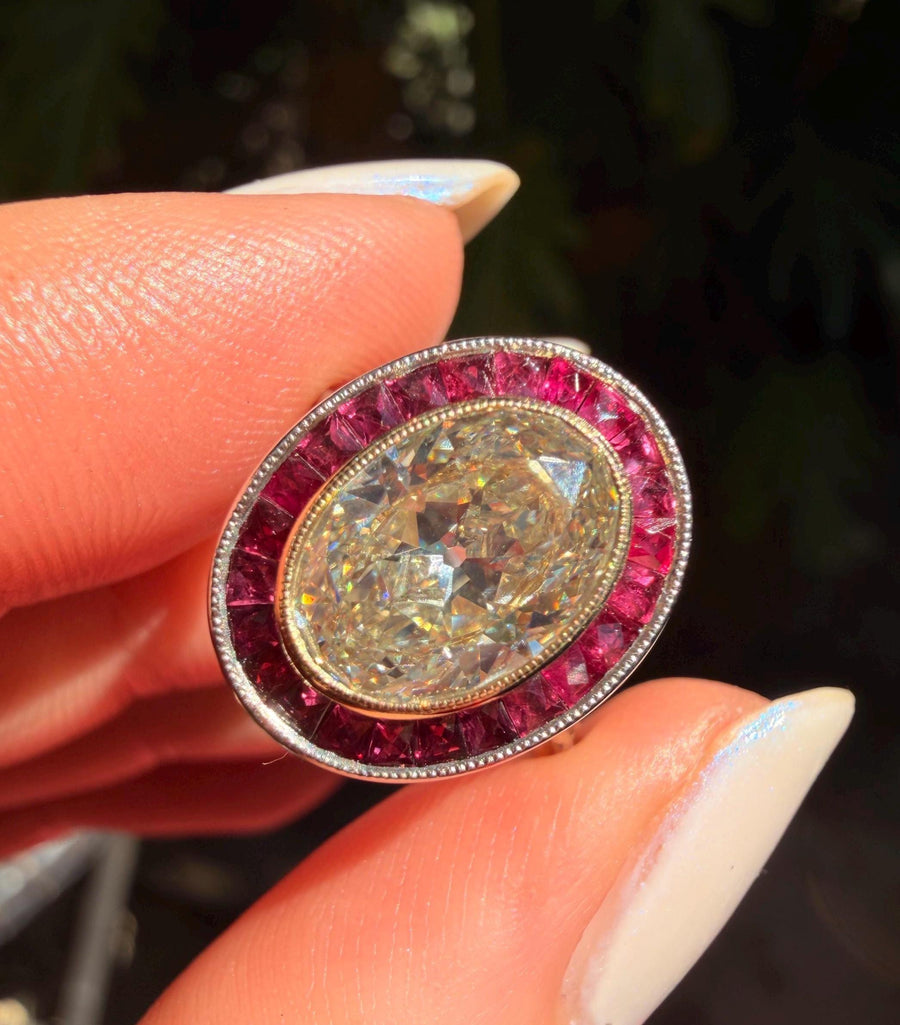 2.49 ct antique cut oval diamond ring with natural ruby halo