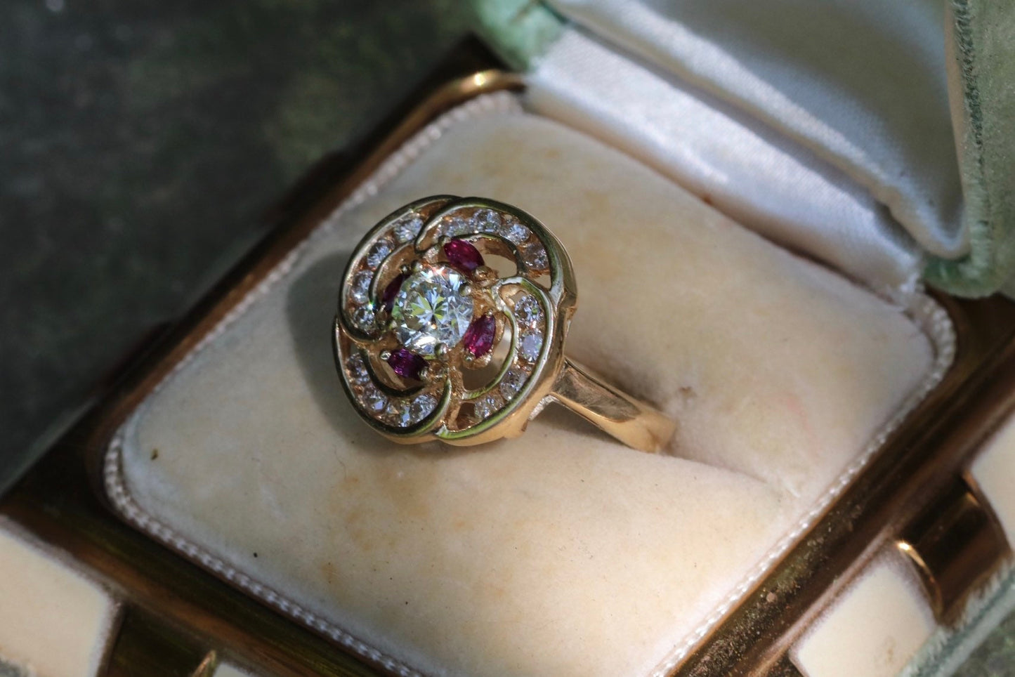 Transitional cut diamond set in 14k yellow gold surrounded by rubies and modern round diamonds size 5.75 (sizable)