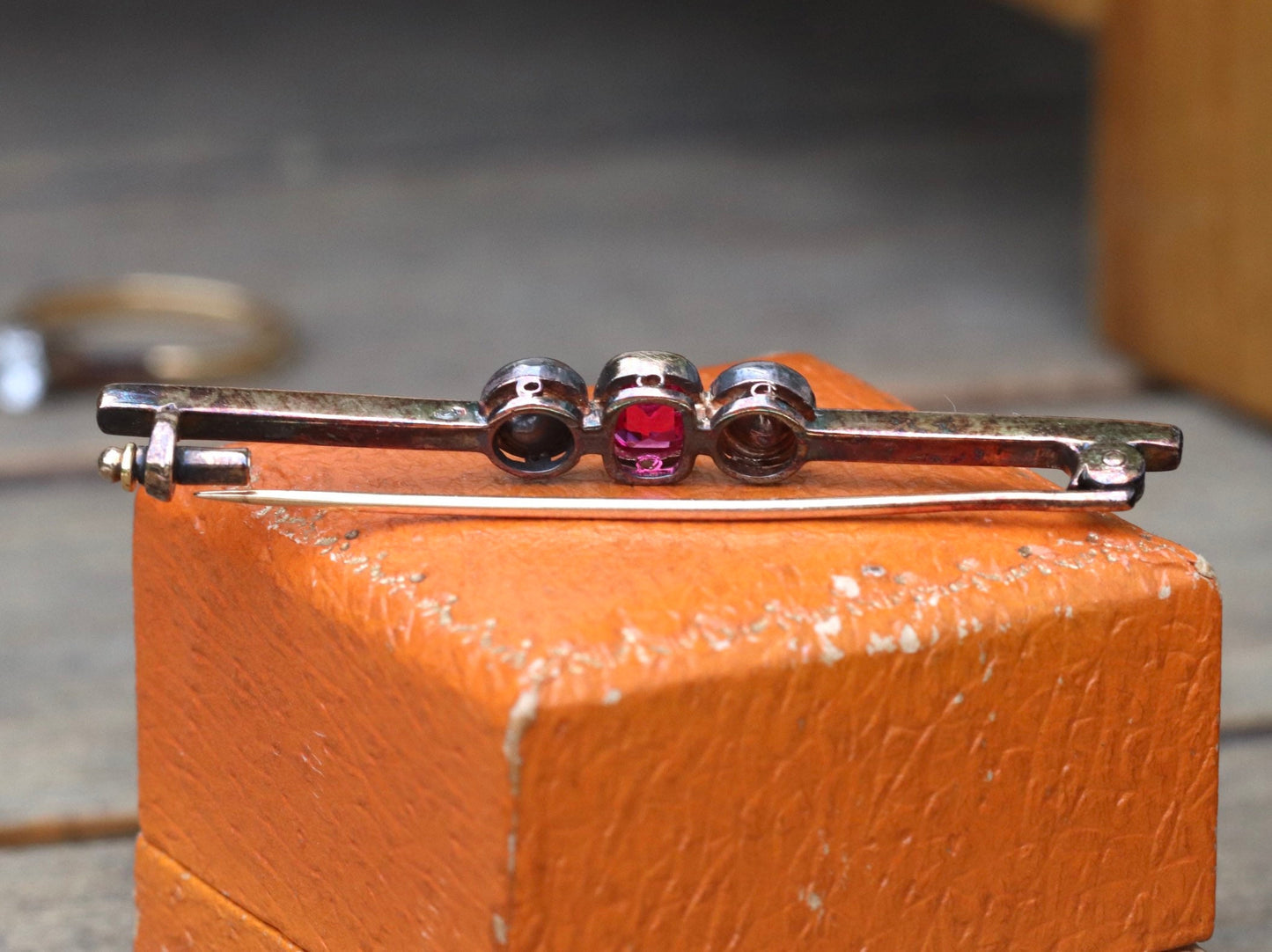 Synthetic ruby and rose cut diamond three stone pin set in 14 karat rose gold