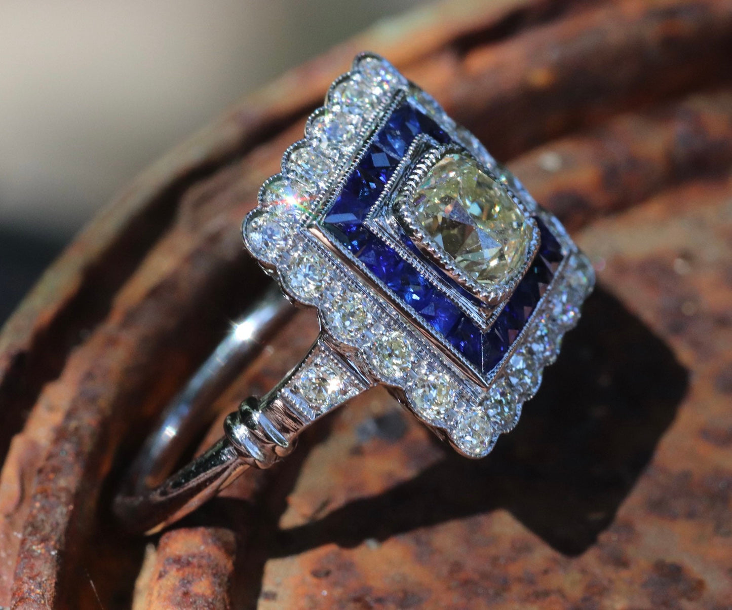 Art Deco inspired old mine cut diamond and French cut sapphire ring in 14k white gold