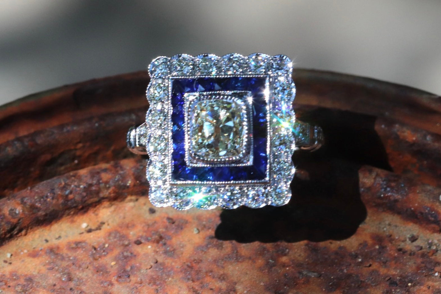 Art Deco inspired old mine cut diamond and French cut sapphire ring in 14k white gold