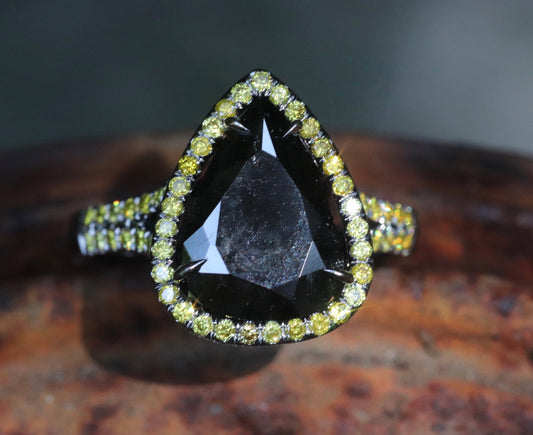 Black and yellow diamond pear-shaped engagement ring in 14 karat black gold size 6.5