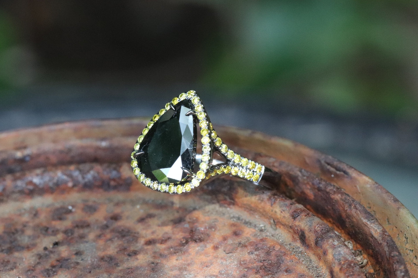 Black and yellow diamond pear-shaped engagement ring in 14 karat black gold size 6.5