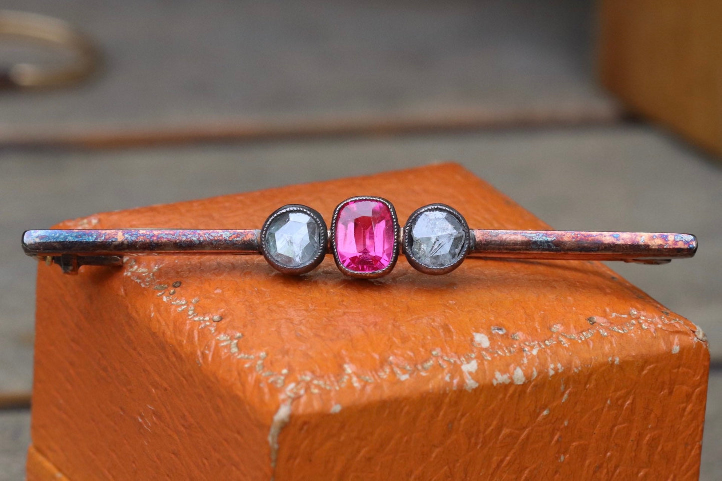 Synthetic ruby and rose cut diamond three stone pin set in 14 karat rose gold
