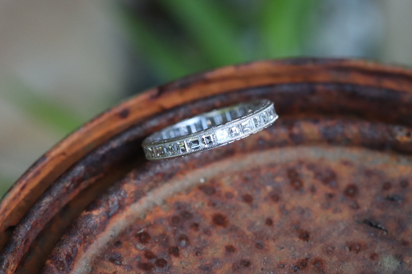 Engraved carre cut diamond eternity band set in platinum size 5