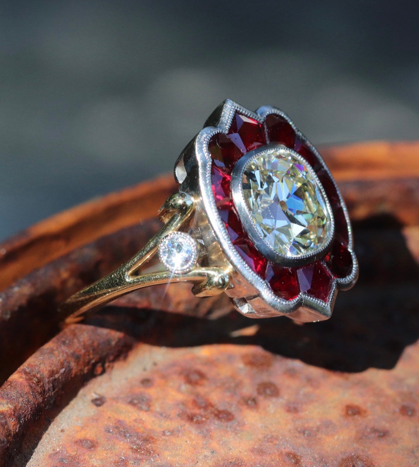 GIA certified old mine cut diamond with natural ruby halo in hand forged customs ring