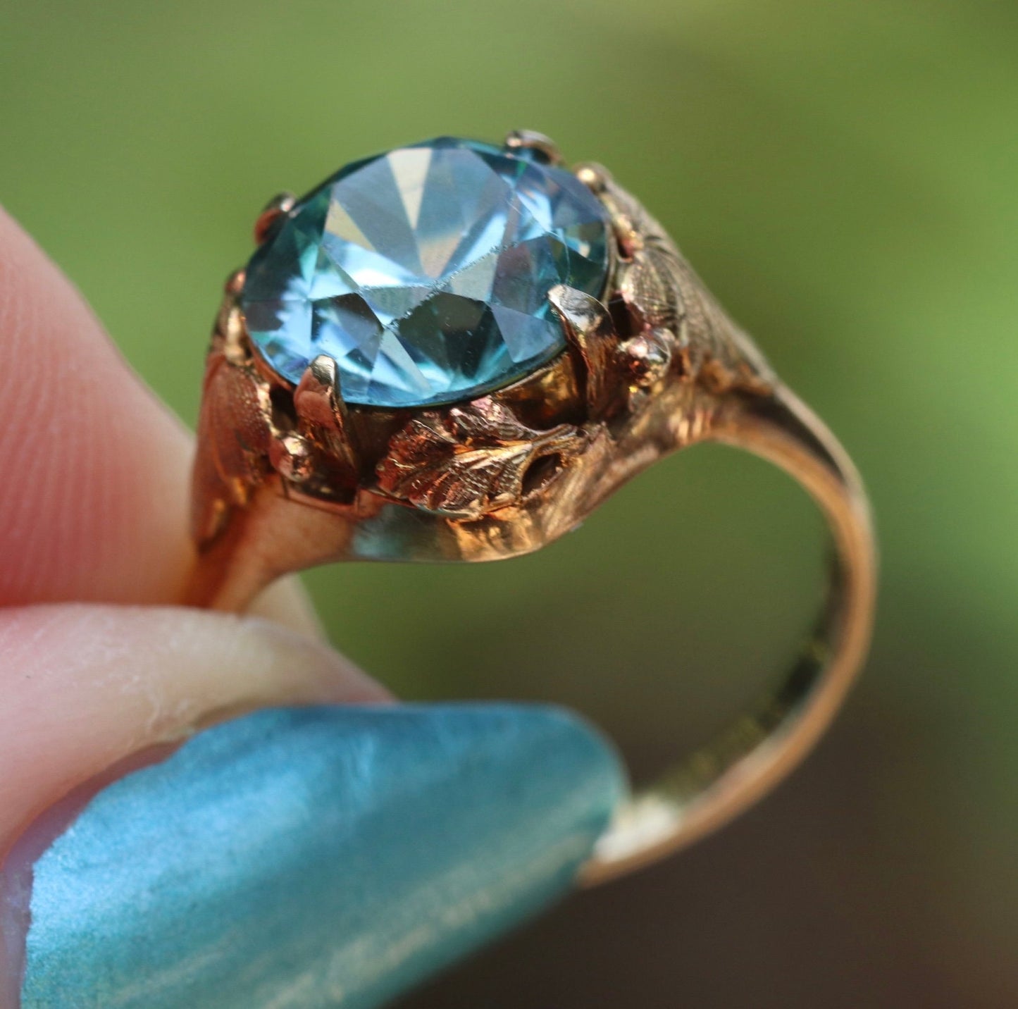 Approximately 5 carat Art Nouveau 14k yellow/rose gold blue zircon ring