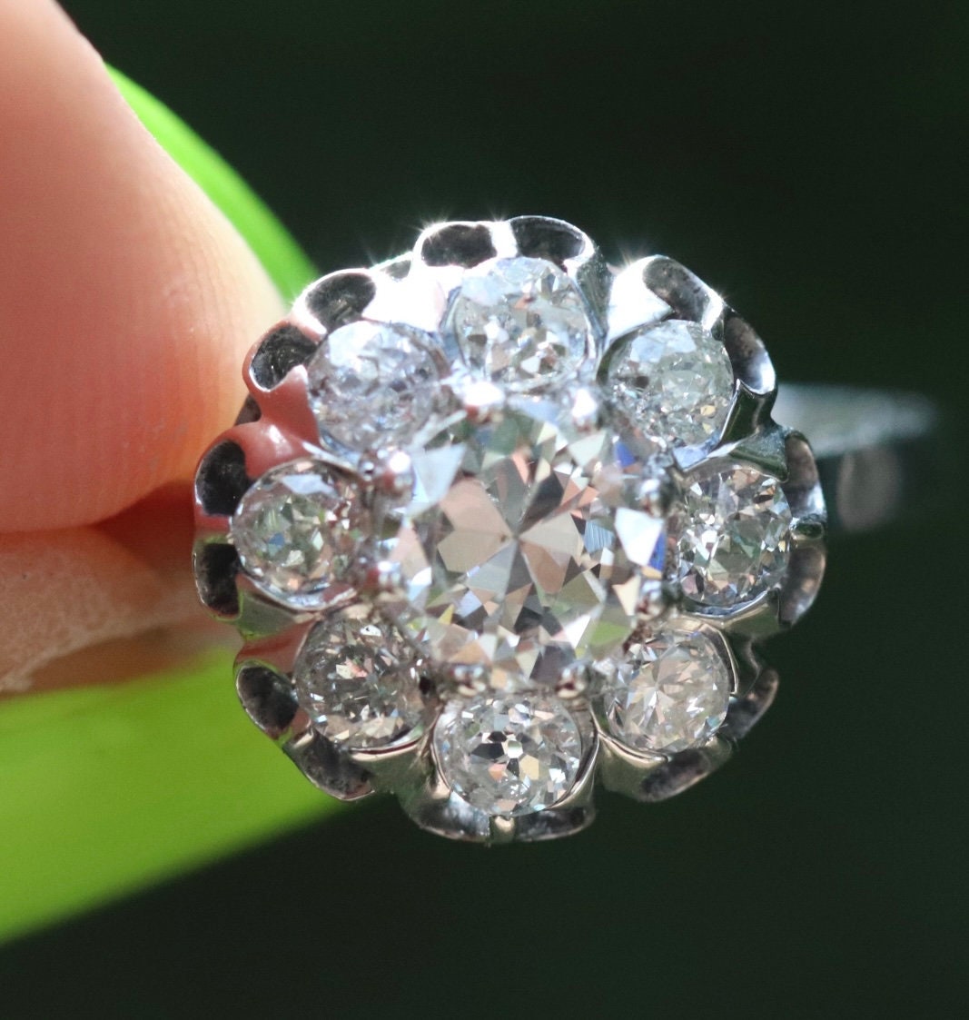 Approximately 1.75 ctw antique diamond cluster ring Set in 18k white gold
