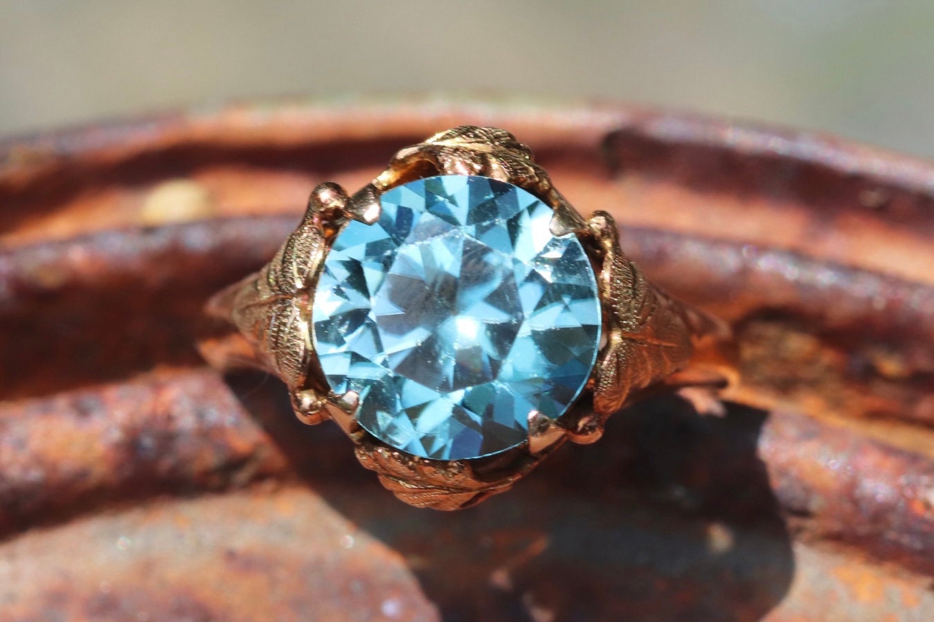 Approximately 5 carat Art Nouveau 14k yellow/rose gold blue zircon ring